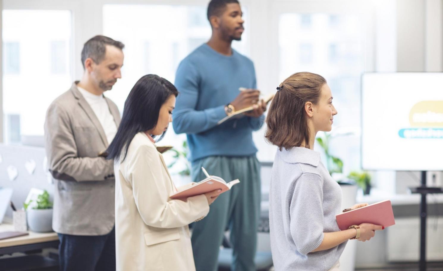 Student working on financial modelling assignment with laptop and notes